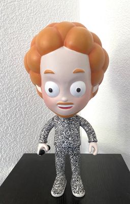 a close up of a figurine of a man with orange hair