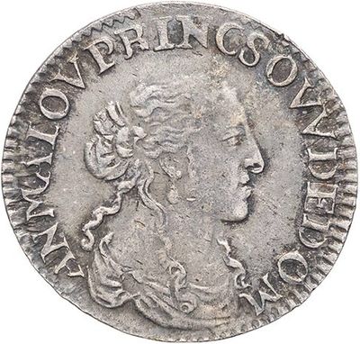 a silver coin with a woman ' s face on it