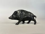 black pig figurine on a white background
