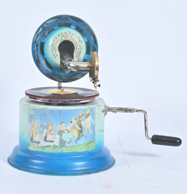 une boîte à musique bleue et blanche sur laquelle figure une image