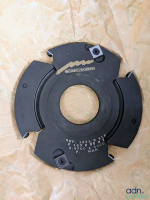 a close up of a metal disc with a hole in the middle