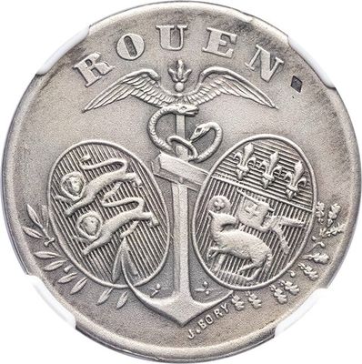 l'image d'une pièce d'argent représentant une ancre et un serpent