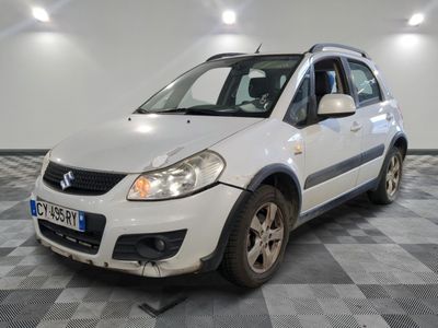 a picture of a small white car parked in a garage