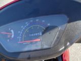 a close up of a motorcycle speedometer on the handlebar