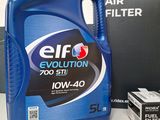 an image of a bottle of engine oil next to a box of filters