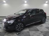 a black car is parked in a large room with a checkered floor