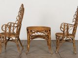 two chairs and a table are sitting on a tile floor