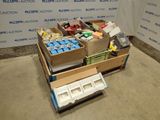 many boxes of assorted items sitting on the floor