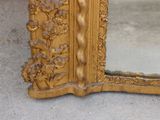 a mirror that is sitting on the floor in front of a wall