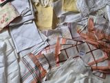 many different types of clothing on the bed
