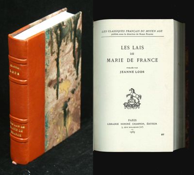 two books that are sitting next to each other on a table