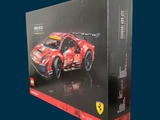 a box with a model of a racing car in it