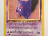 a close up of a pokemon card on a white surface