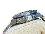 a close up of a watch on a white cloth