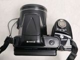 a camera that is sitting on a table with a strap around it