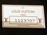 an image of a louis vuitton label on a black shirt
