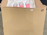 a cardboard box with a pair of scissors in it