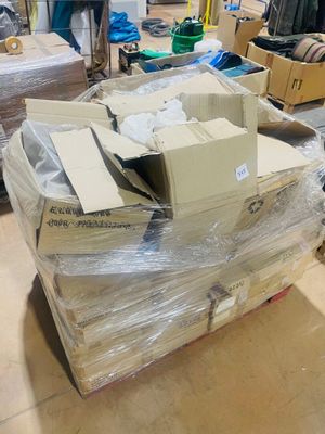 a pile of boxes sitting on the floor in a room