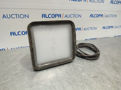 a close up of a metal object on a table near a wall