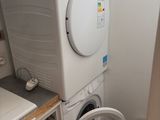 a washer and a dryer in a small room