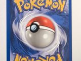 a close up of a pokemon card on a white surface