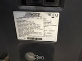 a close up of a machine with a label on it ' s side