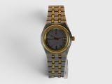 an image of a gold and black watch on a white surface