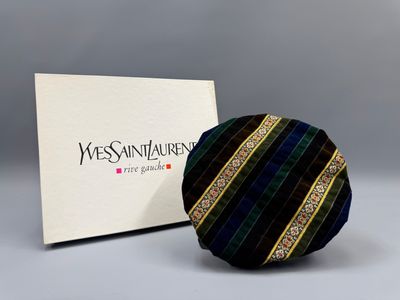 a picture of a black and blue tie and a box