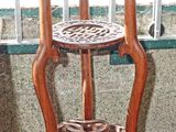 a wooden table with a shelf on top of it
