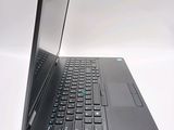 a laptop computer that is sitting on a white surface
