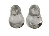 pair of clear glass salt and pepper shakers on a white background
