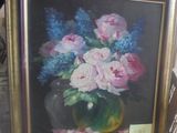 une image d'un tableau de fleurs dans un vase sur une table