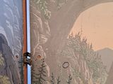 a picture of a painting on the wall of a bathroom