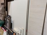a man that is standing in a room with a machine