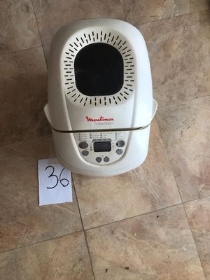 a small air fryer on the floor with a price tag on it