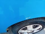 a close up of a car ' s tire on the road