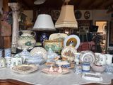 a table with many different types of pottery on it