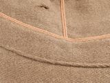 the back side of a tan pants with a zippered pocket