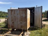a man standing next to a rusted out train car