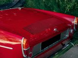 a red car parked on the side of the road