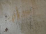 graffiti on the wall of a bathroom with writing on it