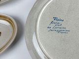 many plates that are sitting on a table