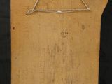 a picture of a piece of wood with a triangle on it