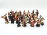 a lot of figurines that are sitting on a white surface