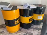three barrels sitting next to each other on the floor