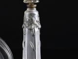a glass bottle with a liquid inside of it