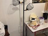 an image of a room with a table and a lamp