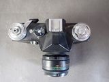 an overhead view of a camera mounted on a wall with a lens attached to it