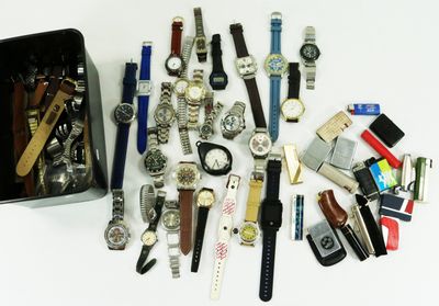 a lot of watches that are sitting on a table