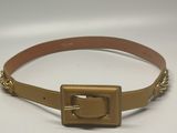 a gold belt with a metal buckle on a white background